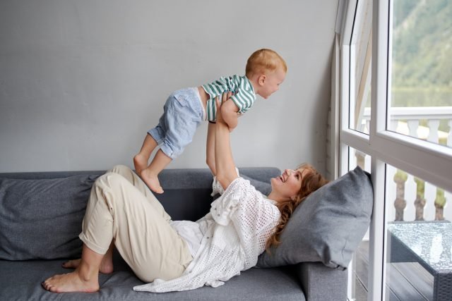 mother relaxing after hiring home cleaning service in st petersburg